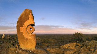 Desert rock carved face landscape - a large rock free wallpaper for desktop