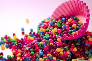 Colorful candy sprinkles white surface - pastel free wallpaper