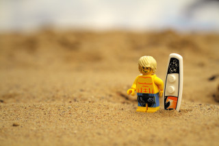 Lego man beach sand surfboard - a cell phone free wallpaper