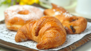 Croissants on plate next to - a cup free wallpaper for desktop