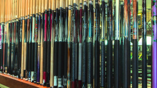 Baseball bats store rack wall - a store free wallpaper