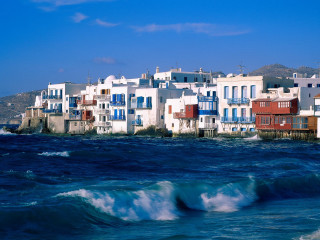 Houses cliff ocean waves blue - a row of houses free wallpaper