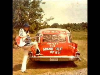 Man sitting red car guitar 2 - his hand and a sign free wallpaper for desktop