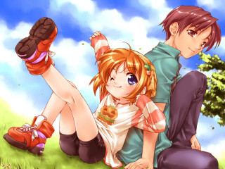 Couple sitting on grass under - top of a grass free wallpaper