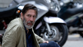 Man sitting ground motorcycle behind - david annand free wallpaper