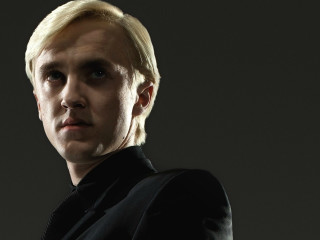 Blonde man black suit serious - plasticien free wallpaper