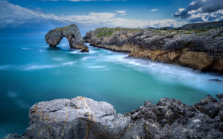 Rocky cliff water rock arch - a rocky cliff free wallpaper