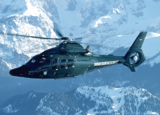 Helicopter flying mountain range sky - over a mountain range in the sky free wallpaper