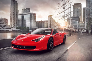 Red sports car cityscape bridge 2 - a city street next free wallpaper