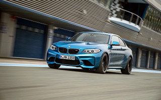 Blue car driving street building 2 - a street next free wallpaper