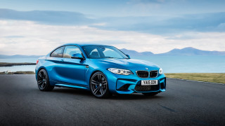 Blue bmw driving ocean mountains - a blue bmw car free wallpaper