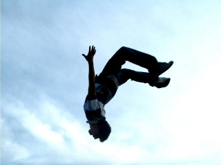 Man flying skateboard air hands - a skateboard in the air free wallpaper