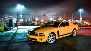 Yellow mustang car night parking - the building free wallpaper
