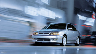 Silver car driving street tall 4 - tall building free wallpaper