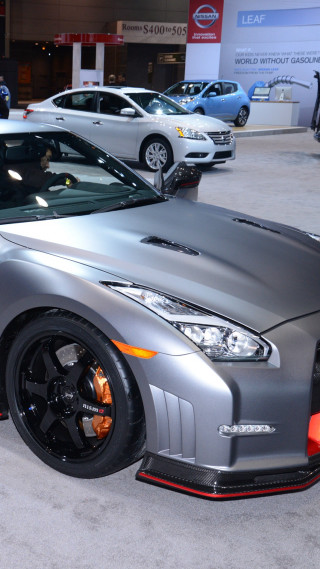 Silver sports car showroom man - free cars wallpaper for mobile