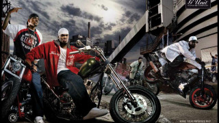Motorcycle riders street tall buildings - a street next free wallpaper