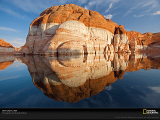 Rock formation water sky clouds - a reflection of it free wallpaper