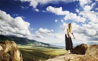 Woman rock formation sky clouds - the sky above her free wallpaper