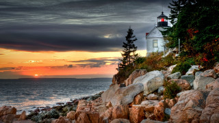 Lighthouse rocky shore sunset clouds 3 - a rocky shore free wallpaper for desktop