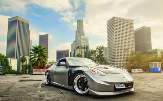 Silver sports car tokyo cityscape - a parking lot in front free wallpaper