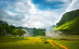 Large waterfall lush field trees - a lush green field free wallpaper