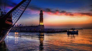 Lighthouse mystical waterboat cityscape dusk - the water and a boat free wallpaper