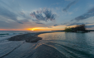 Sunset water island cityscape mountains - a small island in the distance free wallpaper