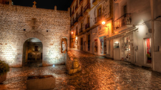 Cobblestone street stone building doorway - free city wallpaper