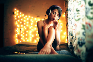Woman sitting headphones blur bokeh - headphone free wallpaper
