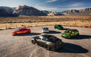 Four cars mountains fenced puzzle - a parking lot in front free wallpaper