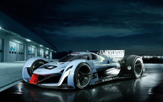Silver race car night building - realistic free wallpaper for desktop