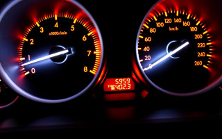 Speedometer closeup red white lights - motion blur free wallpaper