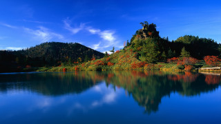 Lake mountain trees sky clouds 2 - a mountain in the background and trees free wallpaper