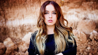 Woman long hair rock wall 2 - a rock wall free wallpaper for desktop