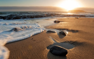 Beach waves sunset rock sand - a rock in the foreground free wallpaper