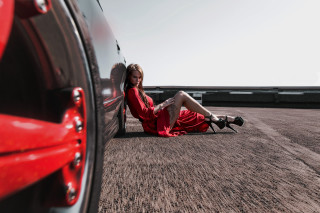 Woman red dress sitting car 2 - the ground next free wallpaper