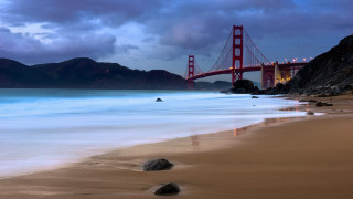Bridge rocks beach sky mountains - photography free wallpaper