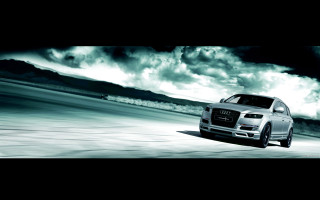 White car driving cloudy sky - a road under a cloudy sky free wallpaper