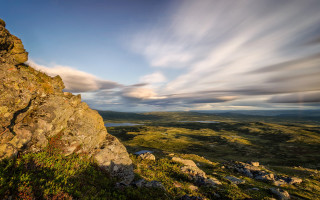 Rocky outcropping lake cloudy sky - a lake below free wallpaper