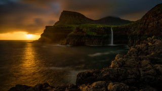 Waterfall mountain lake sunset reflection - a mountain in the background and a body of water free wallpaper