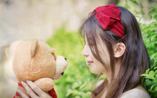 Woman teddy bear smiling red - a teddy bear free wallpaper
