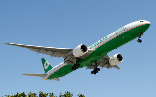 Large green and white airplane - a clear day free wallpaper