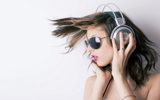Woman sunglasses headphones wind blown - video art free wallpaper