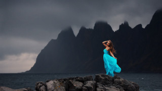 Woman blue dress rocks ocean - dirk crabeth free wallpaper