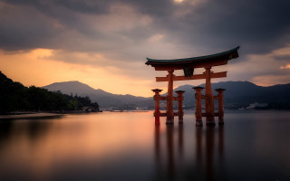 Mountain water torii bridge sunset - a large body of water free wallpaper