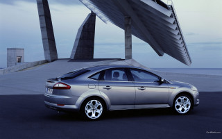 Silver car building sculpture clouds - a silver car free wallpaper