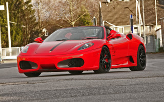 Red sports car driving street 4 - a person in the driver seat free wallpaper