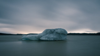 Iceberg lake mountains cloudy sky 2 - top of a lake under a cloudy sky free wallpaper