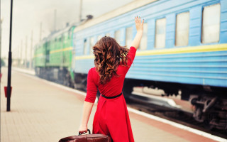 Woman red dress suitcase waving - a train free wallpaper
