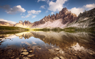Mountain lake rocks grass cloudy - rock and grass free wallpaper